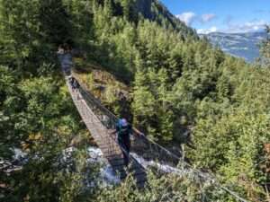 Hikers on a suspension bridge
